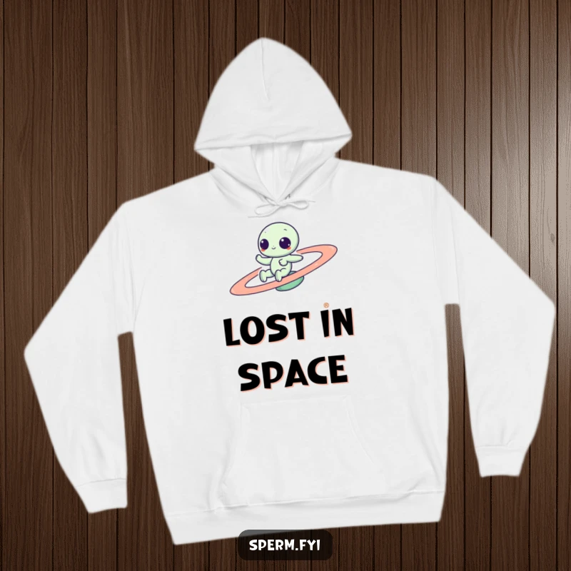 Funny Kawaii alien zipping around a colorful spinning planet, featured on a cozy hoodie, perfect for interstellar warmth and laughs.