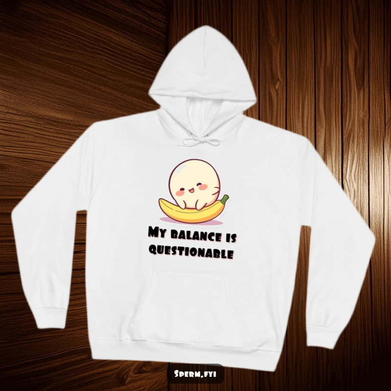 Funny blob character in a hilarious slip on a banana peel, featured on a cozy hoodie.
